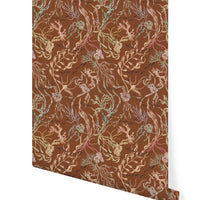 Rolled sample of Atoll Wallpaper in Sienna featuring coral and sea life botanical pattern. Illustrated by Lisel Ashlock.