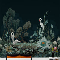 Botanical night scene mural with white herons, flowering plants, and crescent moon on dark background. Illustrated by Lisel Ashlock.