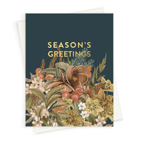 Season's Greetings card with hellebore flowers and berries on dark teal background. Illustrated by Lisel Ashlock.
